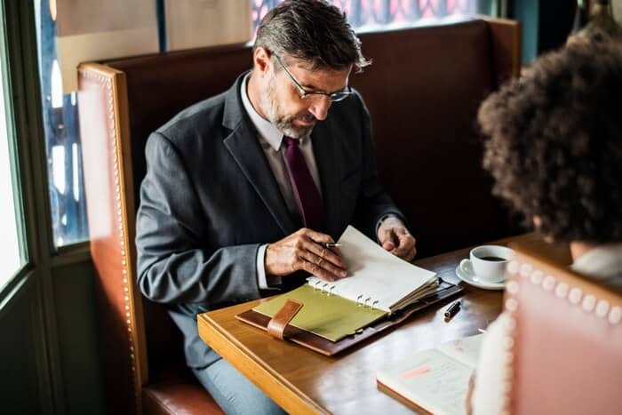 business-people-discussing-cafe_53876-15158 business-people-discussing-cafe_53876-15158